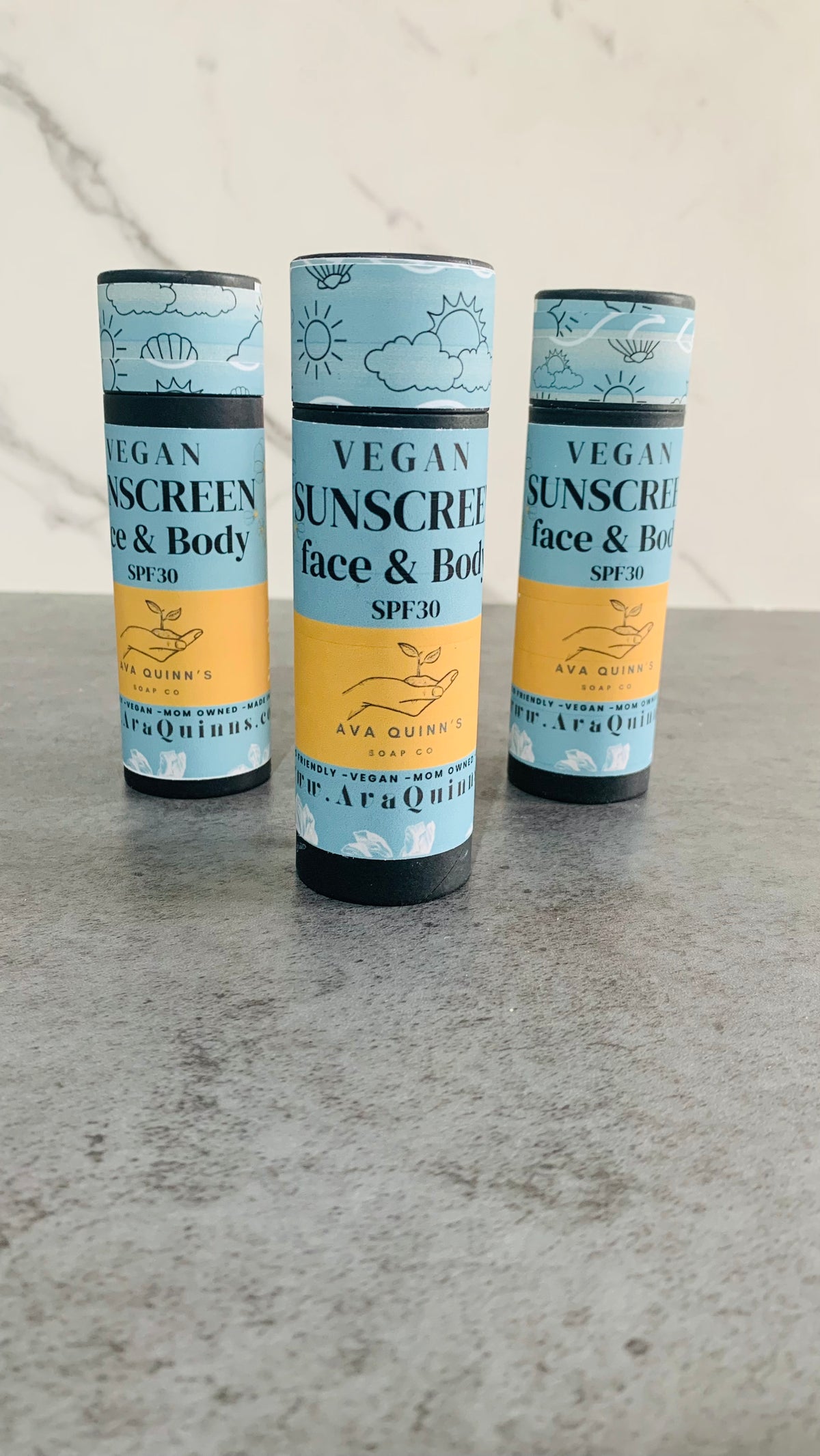 Vegan sunscreen bottle with natural ingredients for face and body protection