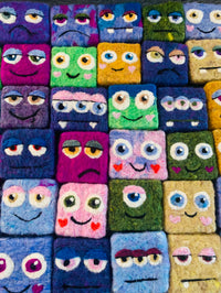 Adorable felted soap monster in vibrant colors, perfect for kids' bath time routines.